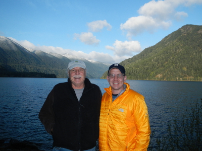 Two participants smile in front of Lake Crescent in Olympic National Park