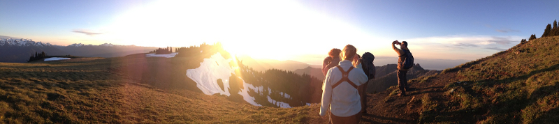 The sun has set so low that four hikers on Hurricane Ridge have trouble seeing towards the northwest into Olympic National Park